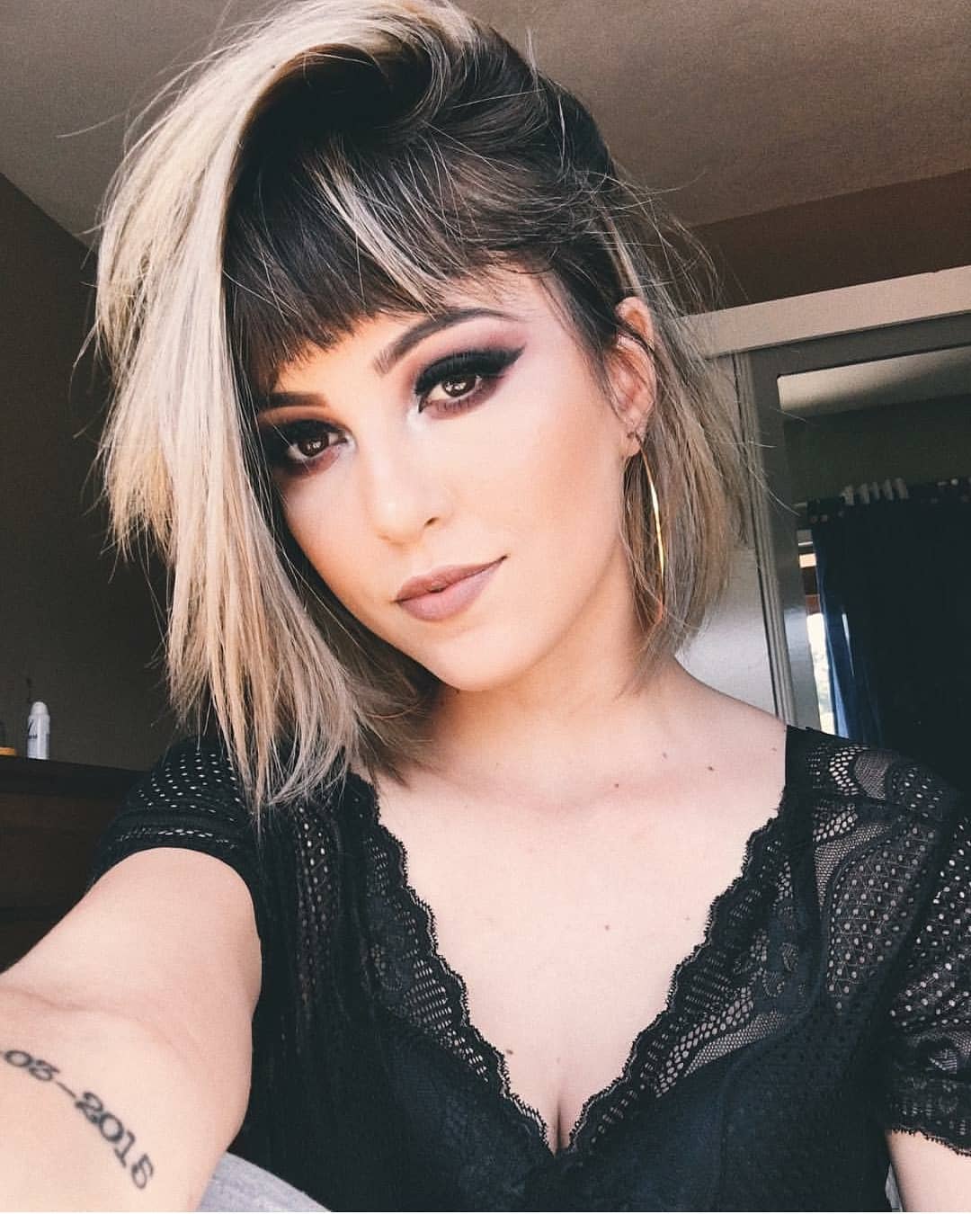 Bangs Complimenting Short Hairstyle with Highlights