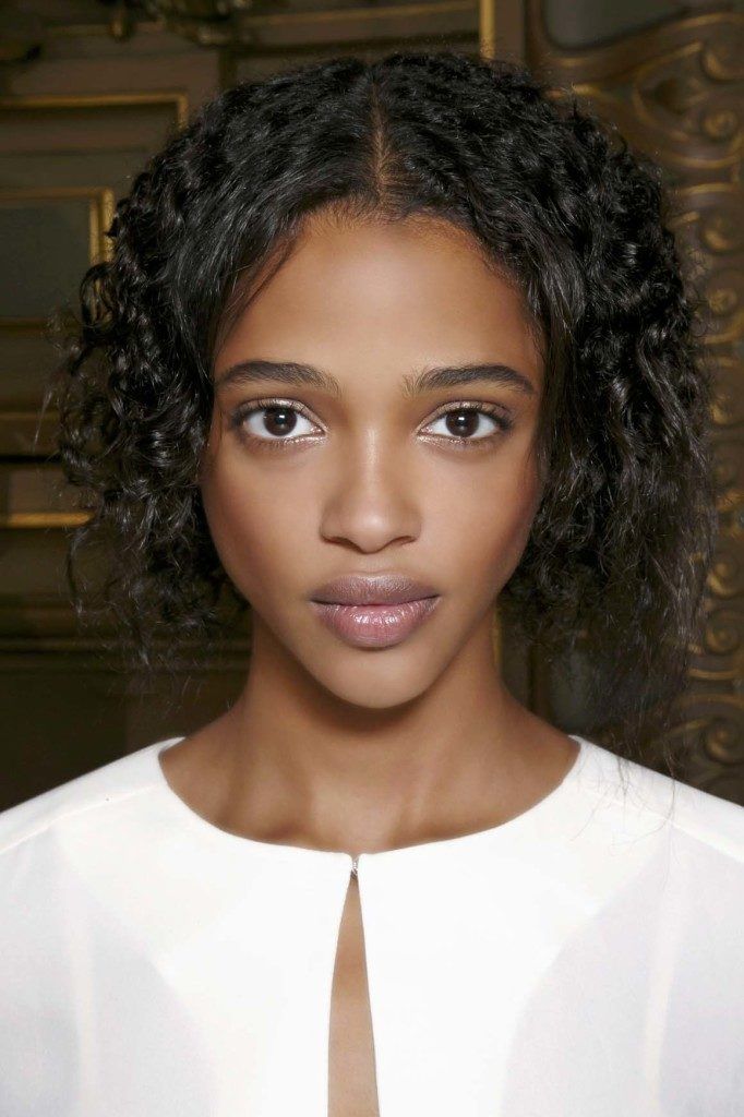 Funky Short Hair with Tiny Perms Parted Sideways