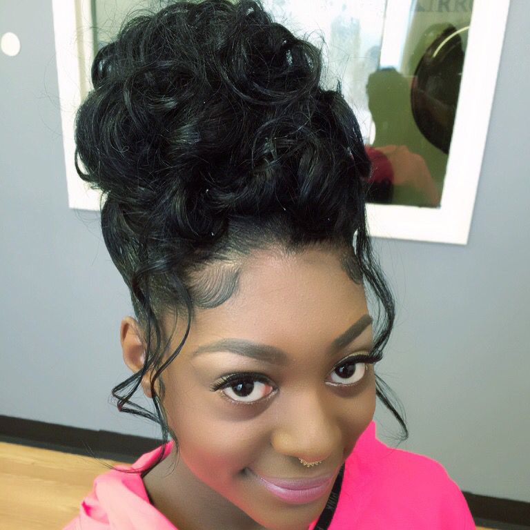 High Bun Prom Hairstyle with Scattered Curly Strands All Over
