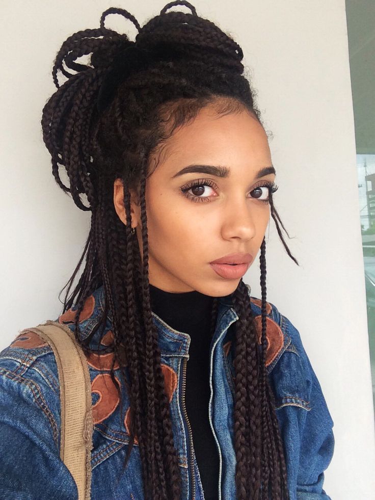 High Bun and Flowing Braided Strands on Shoulders