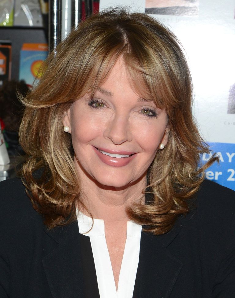Medium Layered Hair with Curls and Parted Bangs