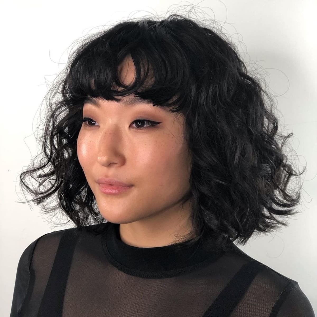 short curly hair bob with bangs
