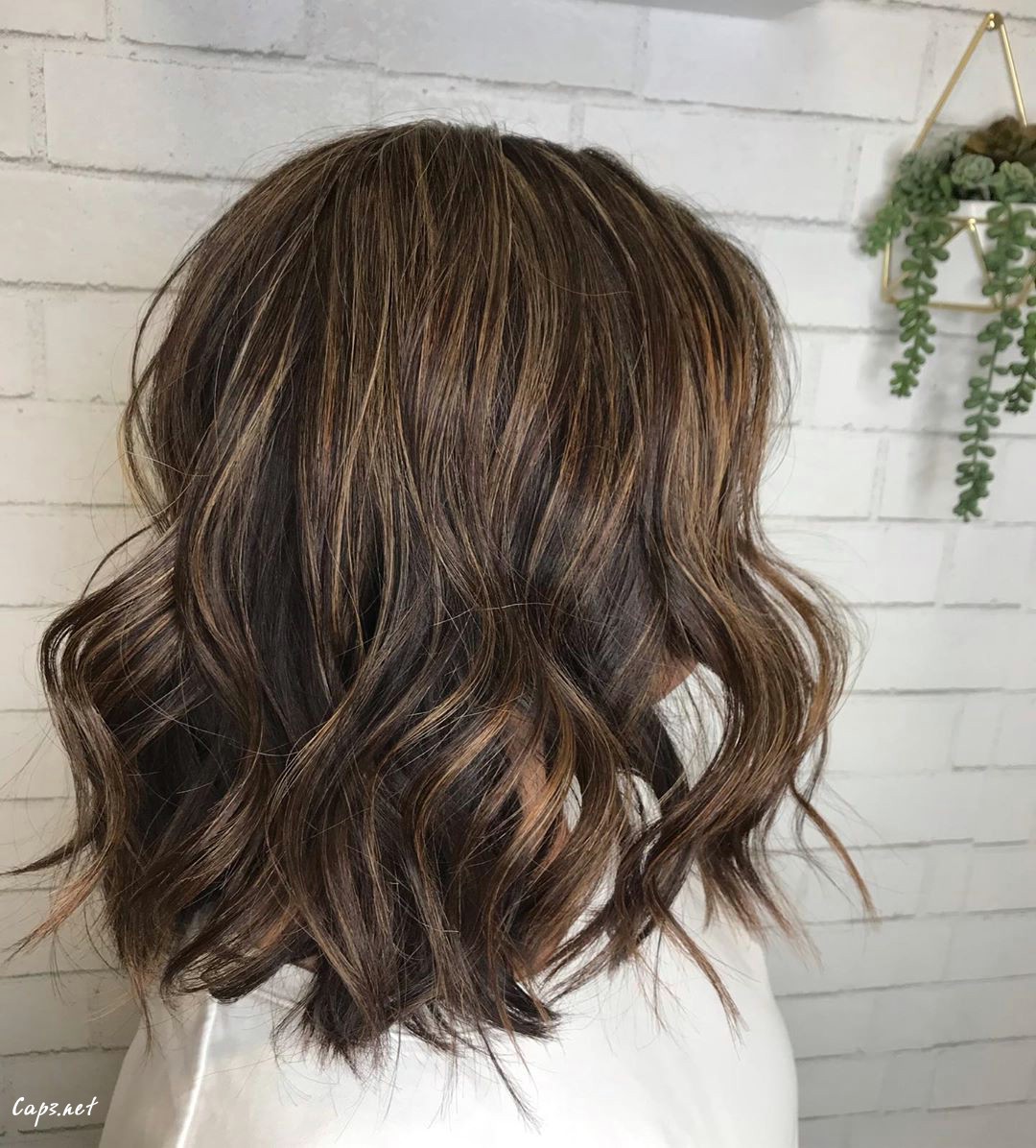 wavy brunette bob cut
