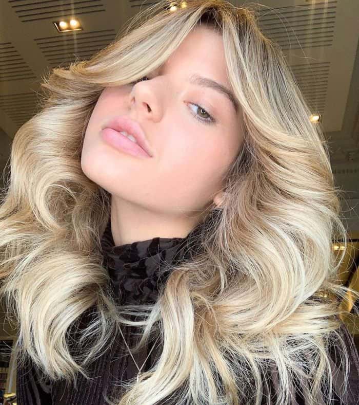 Long Feathered Razor Cut With Blunt Bangs