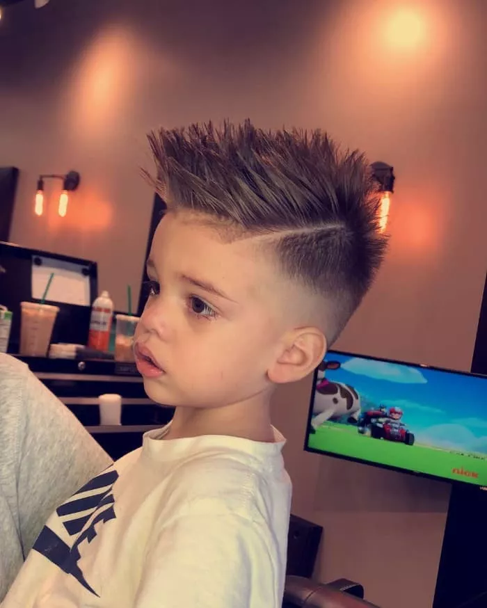 Thick Brushed Up Hair Faded Sides Shaved Line