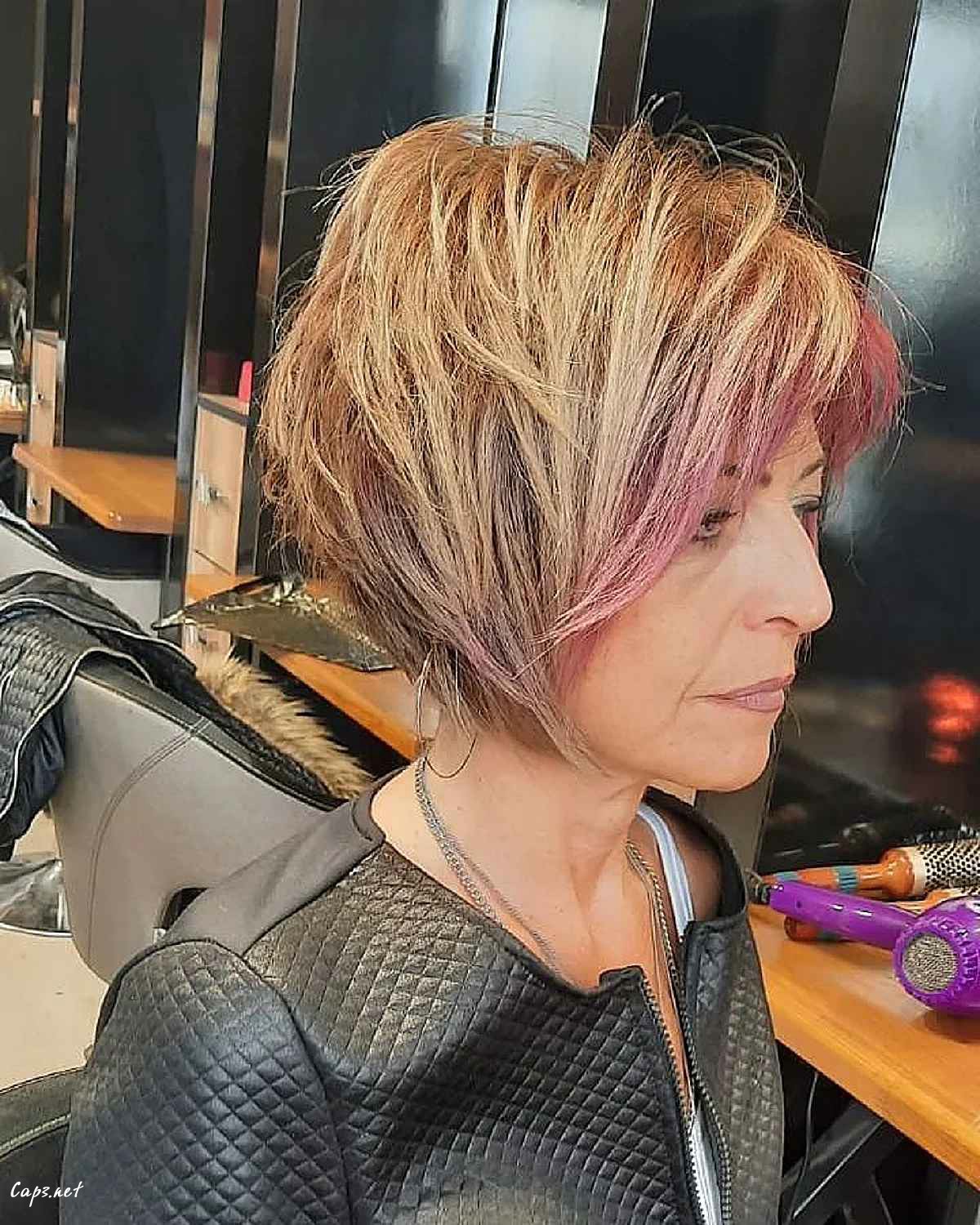 edgier short bob with lots of layering on a sixty year old woman