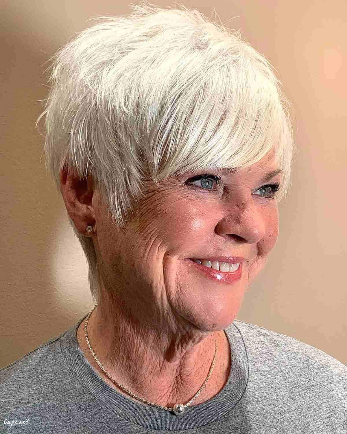 white blonde pixie with long bangs for women over 60 with thin hair