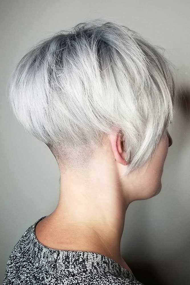 taper haircut women long sleek bob platinum blonde layered inverted long bang
