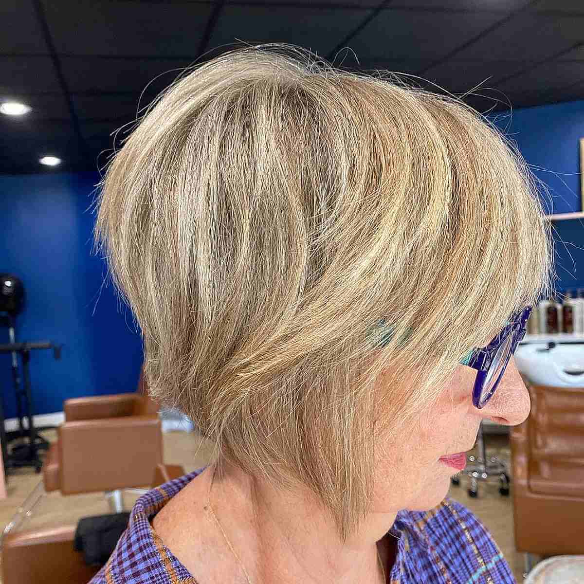 textured bob with blonde lowlights for ladies 60 and over with glasses