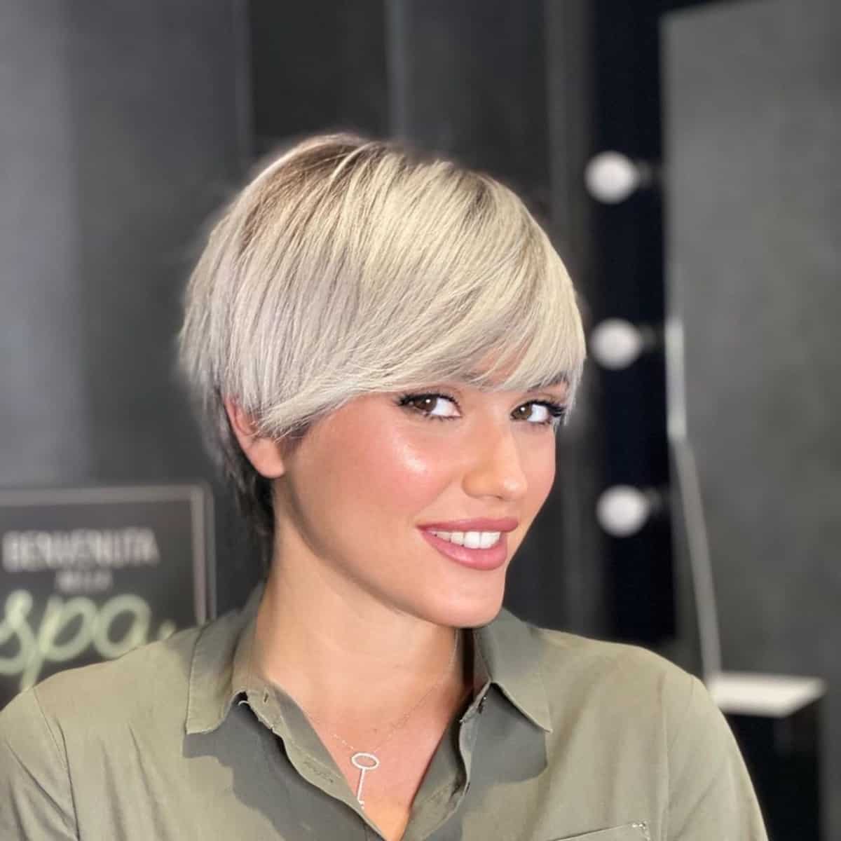 blonde pixie with long bangs