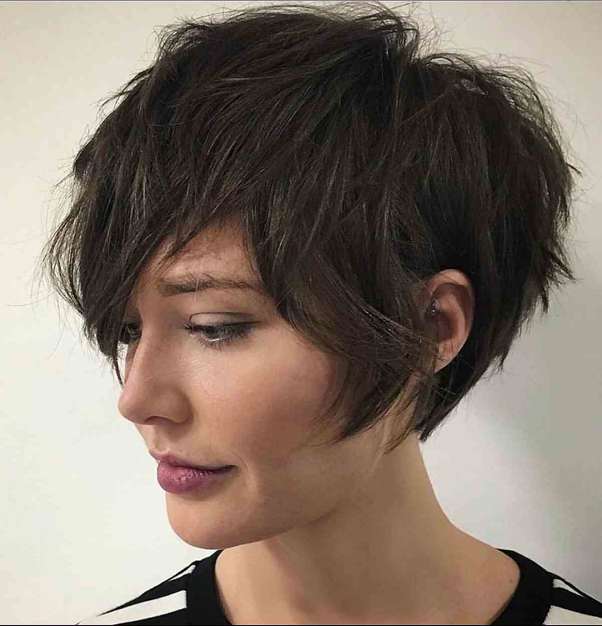 chocolatey messy pixie with sideburns