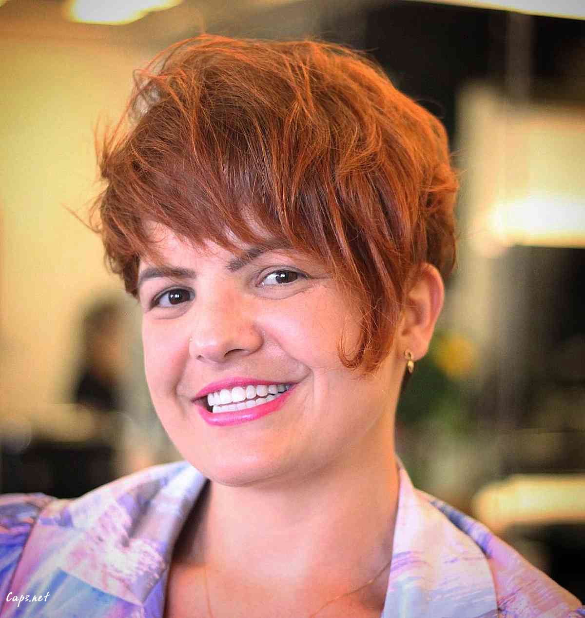 copper messy pixie cut with long bangs