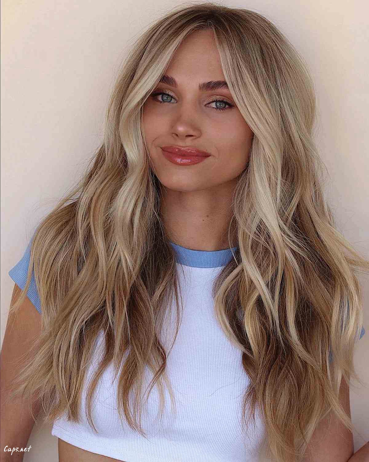 long blonde hair with a middle part for heart faces