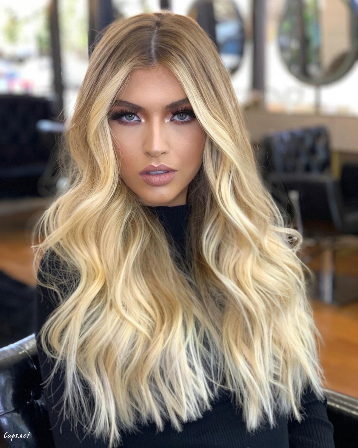 long hair with a center part and a heart face shape