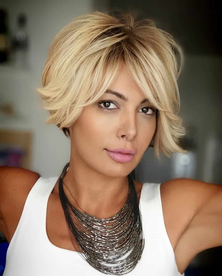 messy long pixie haircut with long bangs