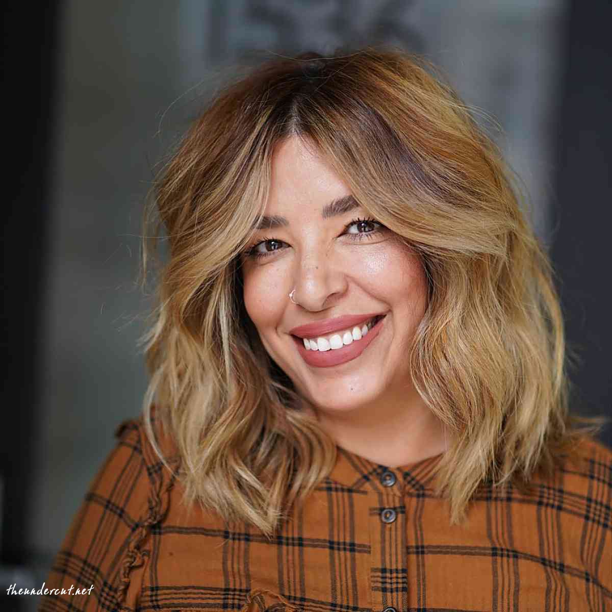 shaggy shoulder length bob and copper balayage
