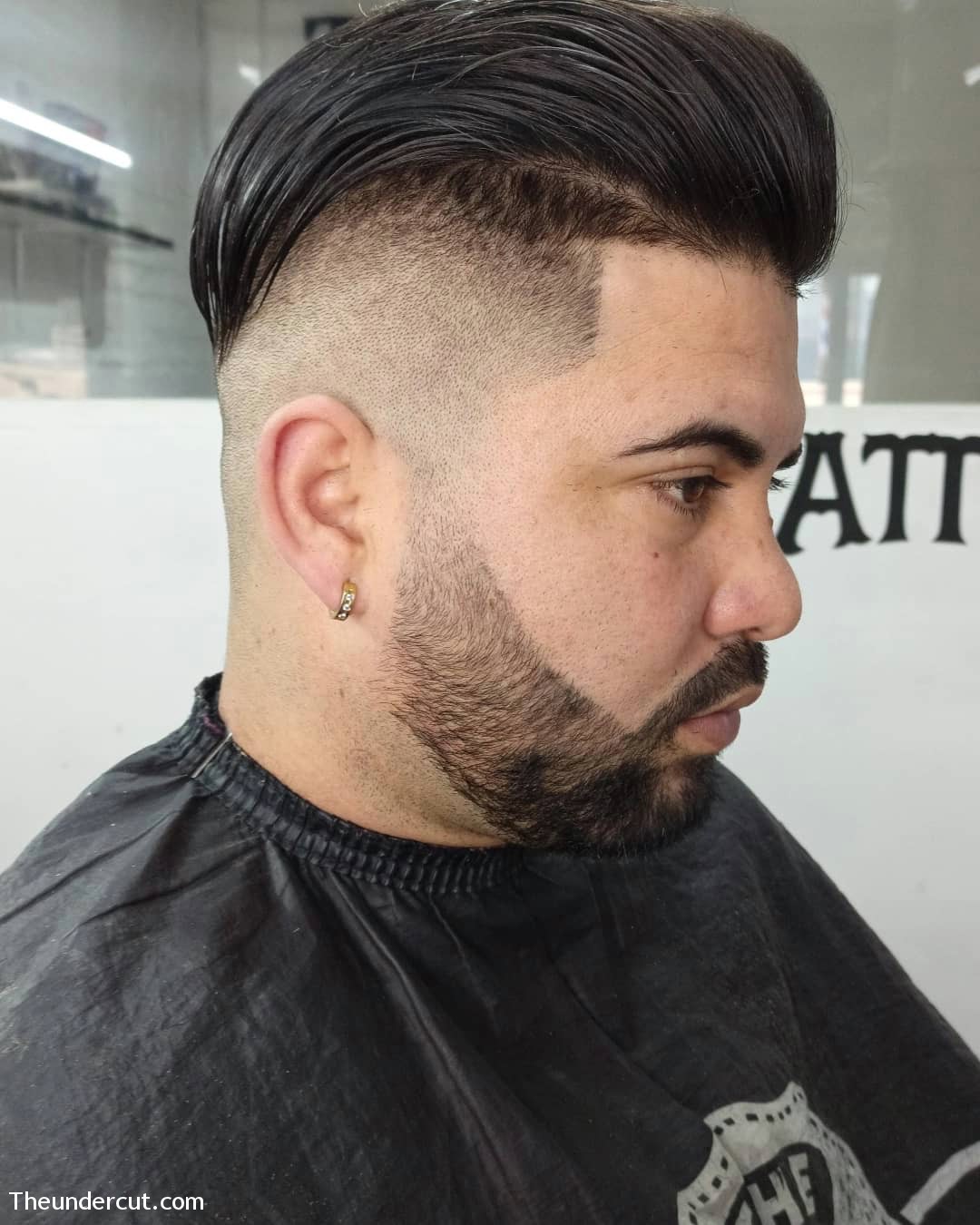 Slick Back Haircut With A Fade