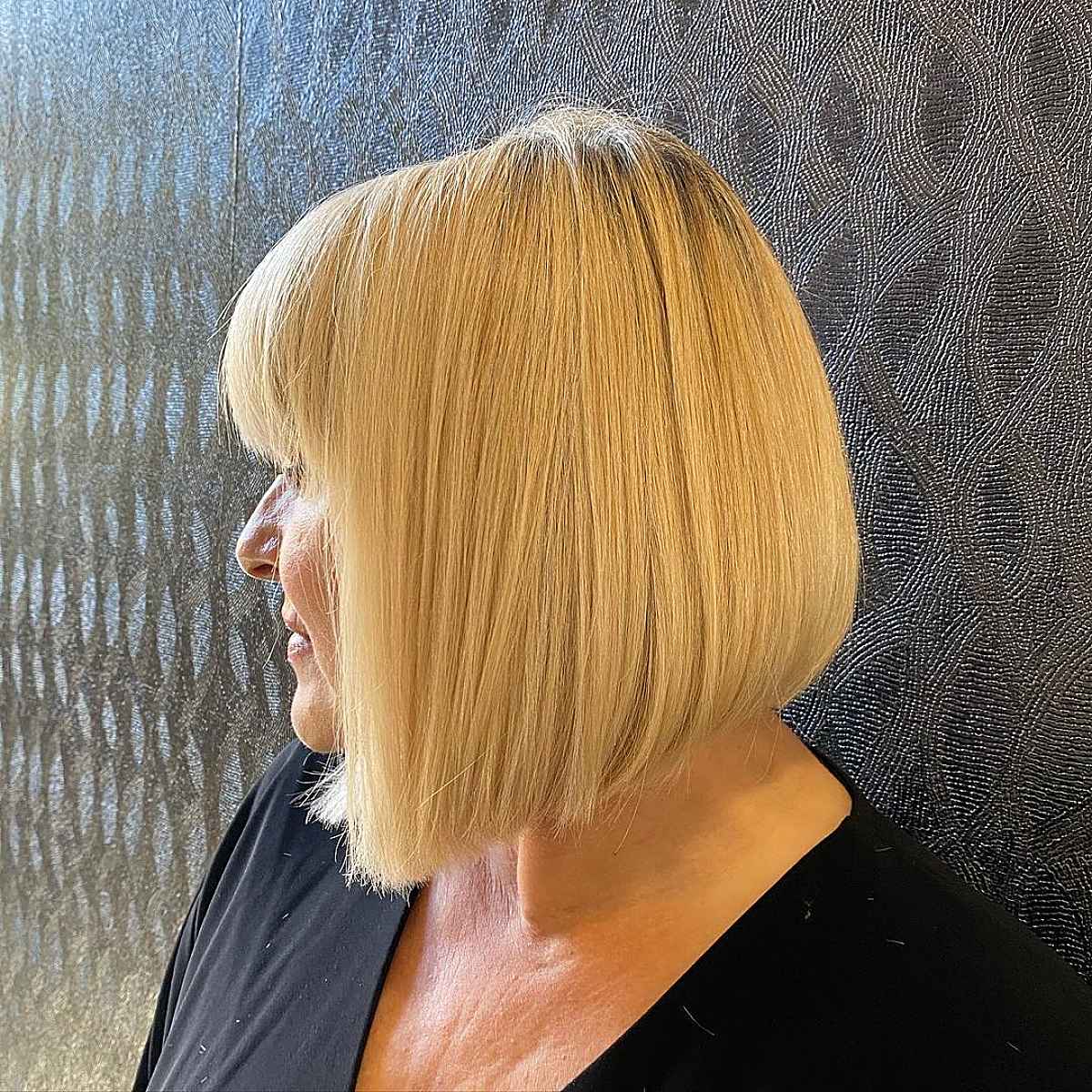 angled bob with bangs for women past their 60s