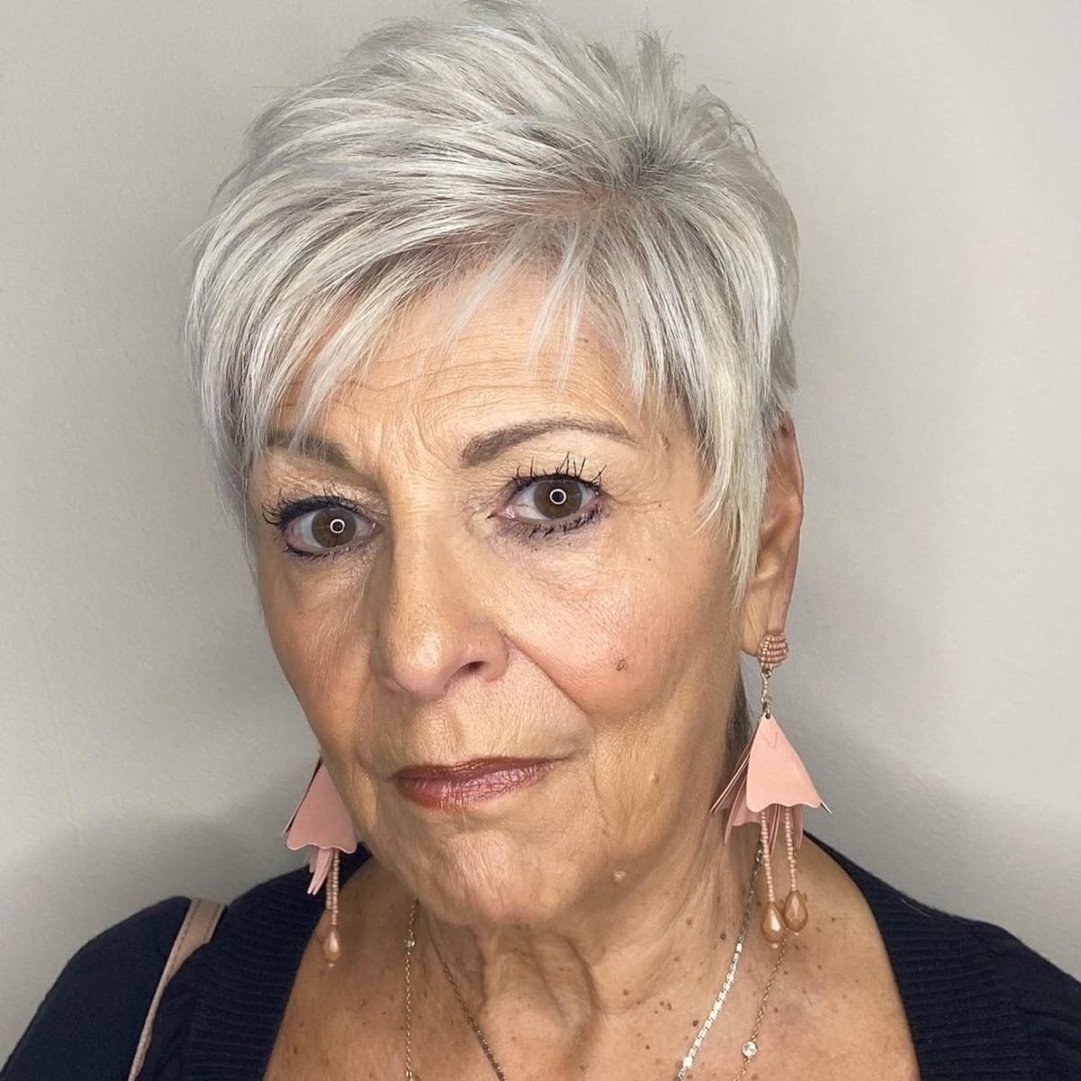 asymmetrical pixie cut for women over 60 with grey hair