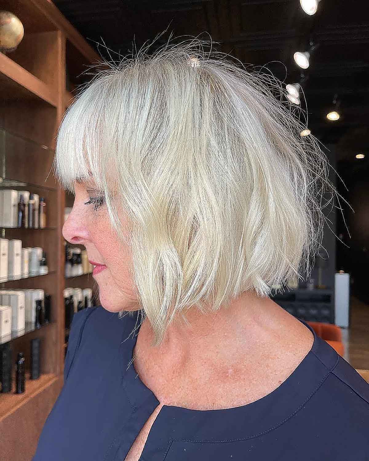 blunt bob with bangs and beachy waves for ladies over 60 with thin hair