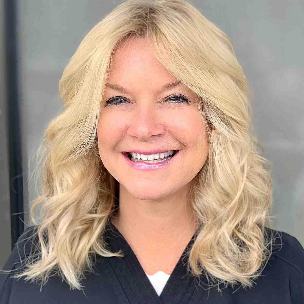 buttery blonde on collarbone length hair for a woman over forty