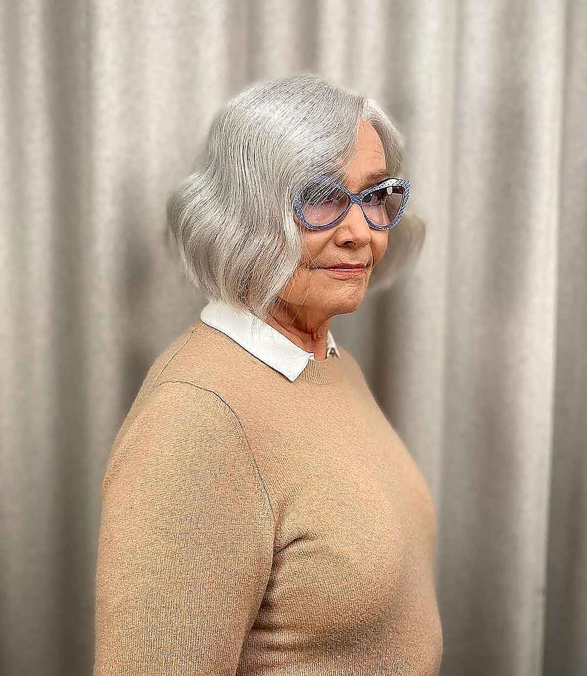 chic wavy bob on a women over 60 with fine white hair