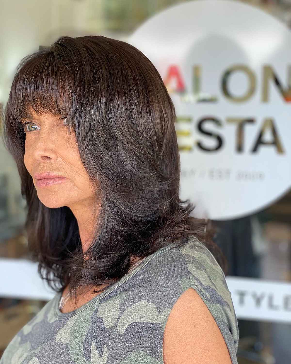 chocolate shag with rounded bangs for ladies over 60