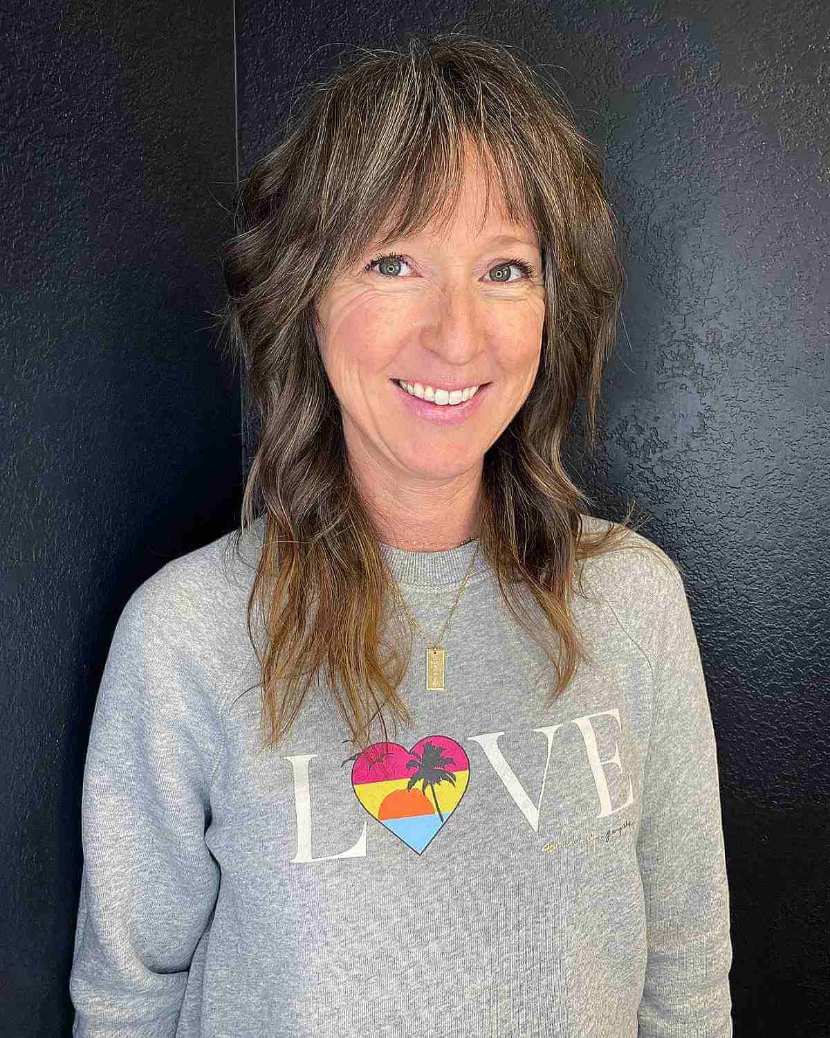 choppy brunette hair with see through bangs for 40 year olds