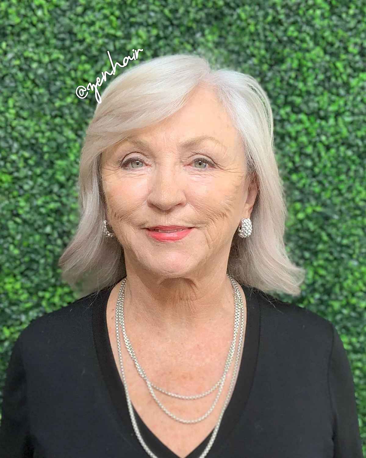 classy mid length cut with a side part for women 60 and up