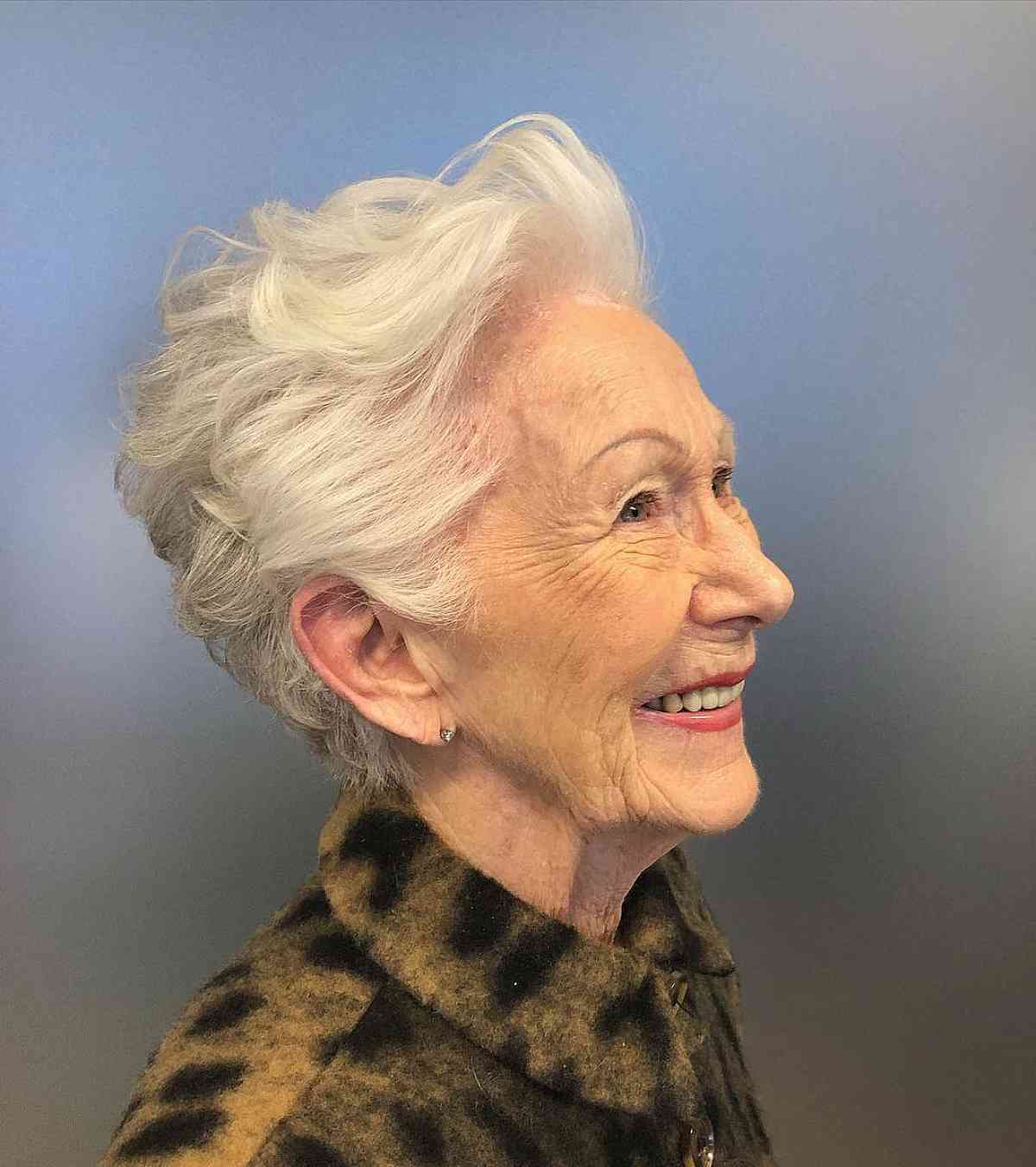 edgy short pixie cut with white hair for a woman in her 60s