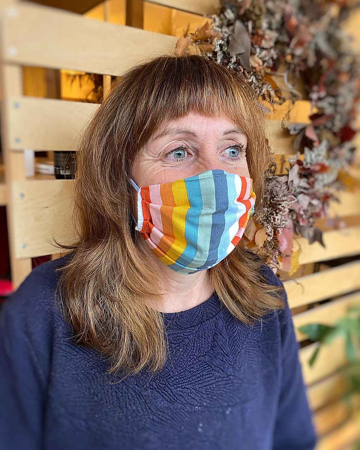 feathered shag with short bangs for women aged 60