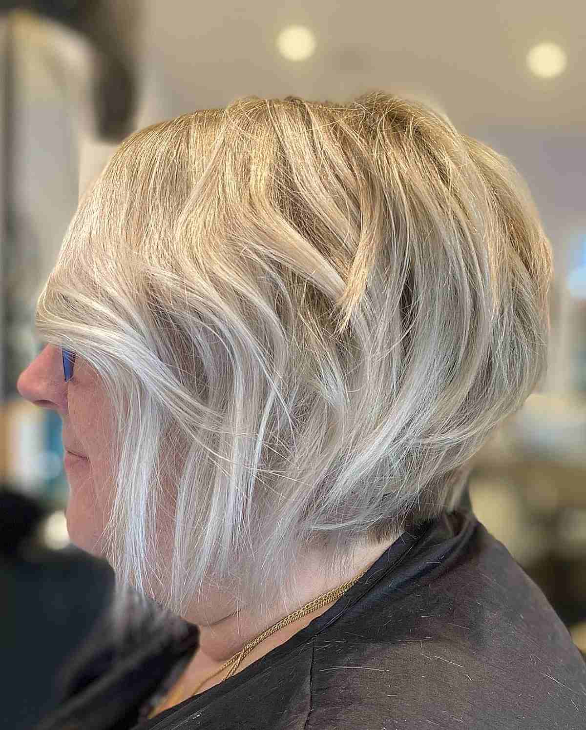 graduated choppy bob on silver hair for 60 year old ladies
