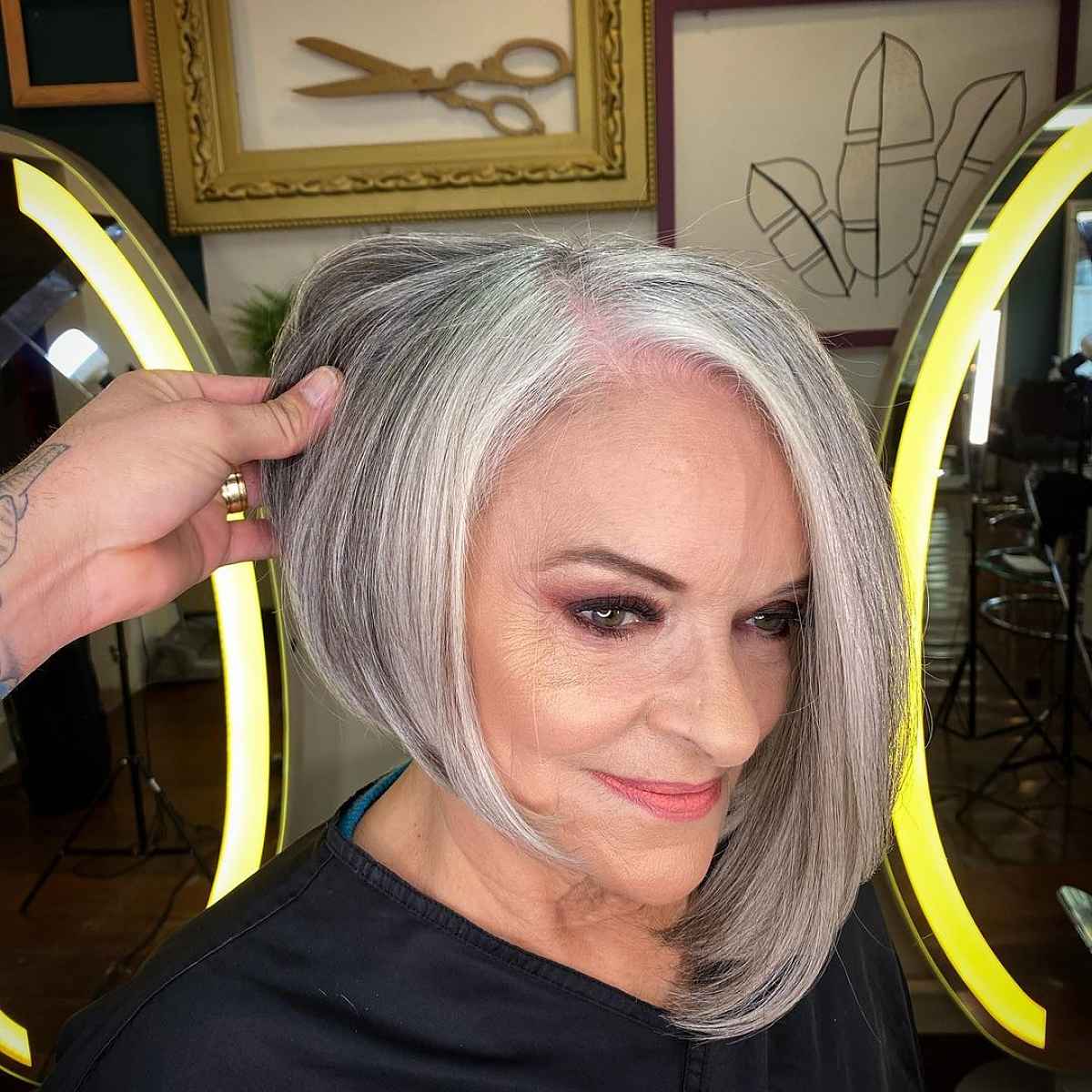 grey asymmetrical bob for women 60 and over with thin hair 1