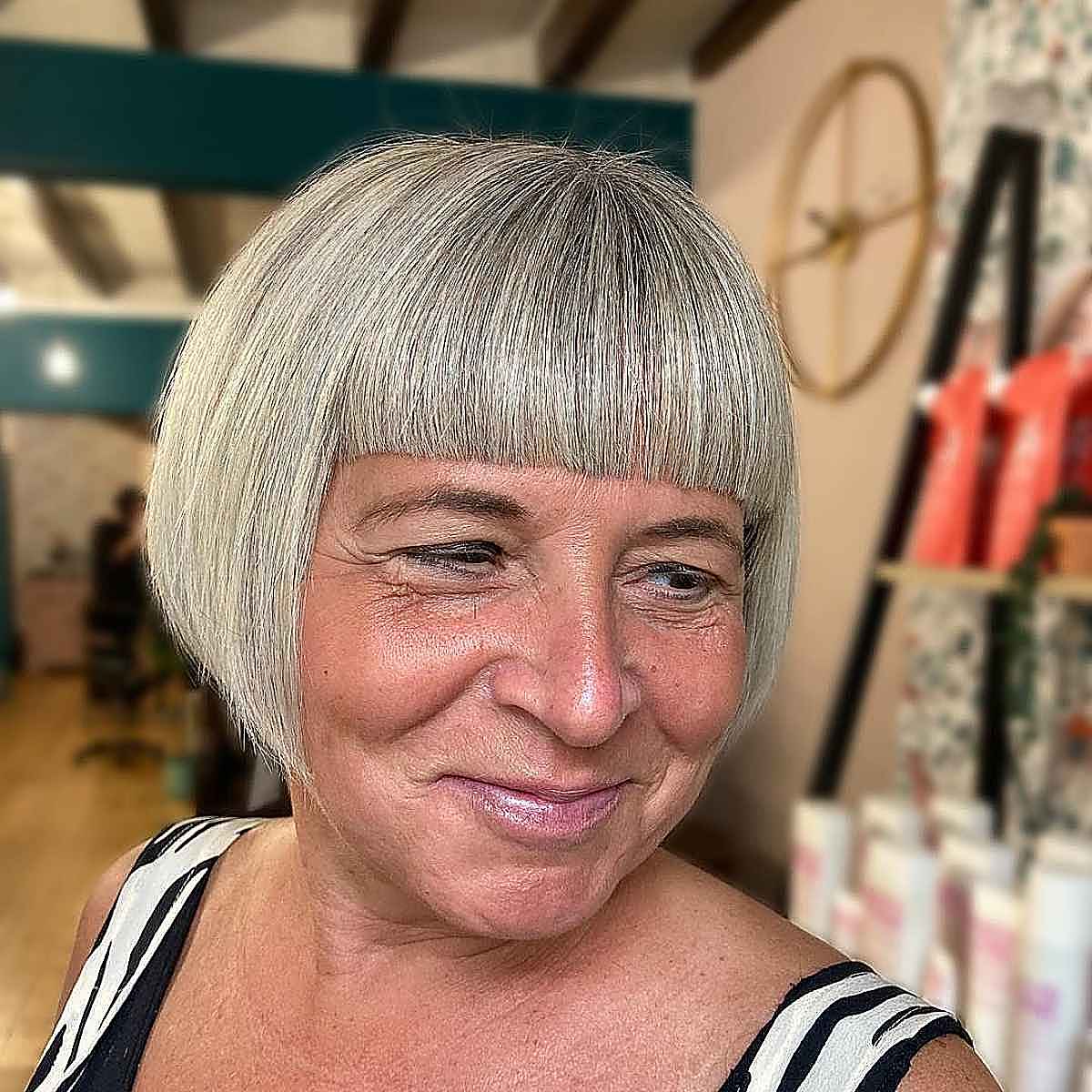jaw length angled bob with bangs for mature women with thin hair