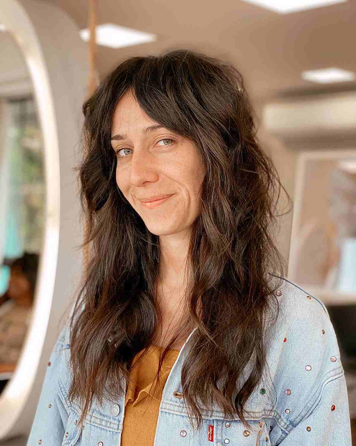 long messy shag with middle part bangs for a lady in her 40s