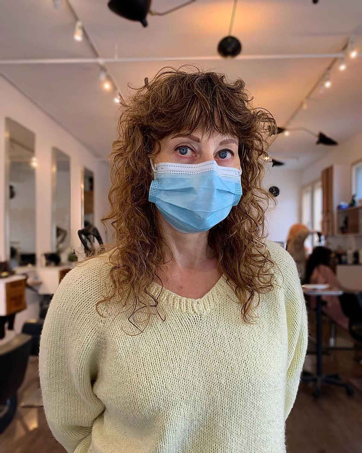 medium curly hairstyle with shagged layers for 60 year old ladies