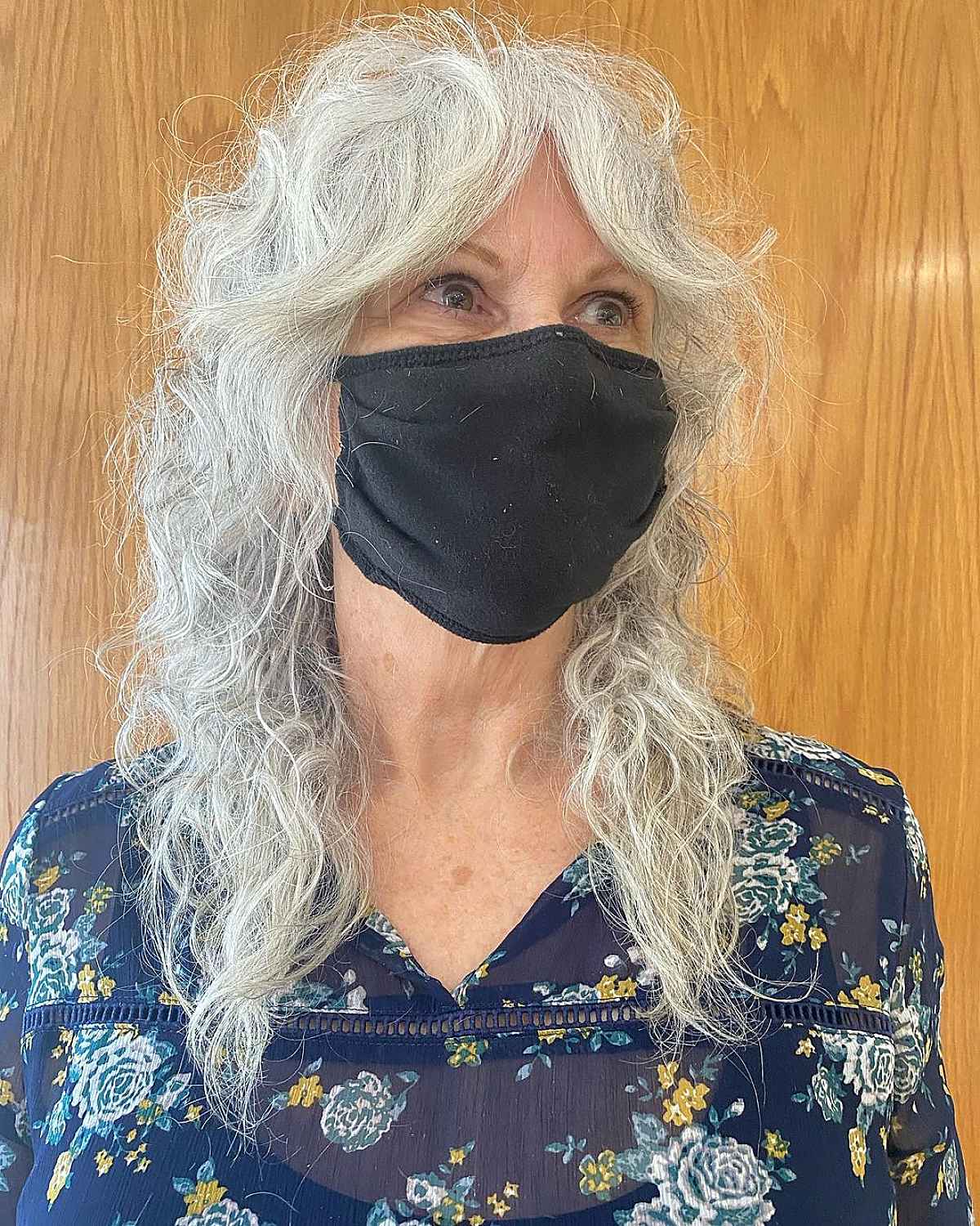 mid length shag with curtain bangs for white haired ladies past sixty