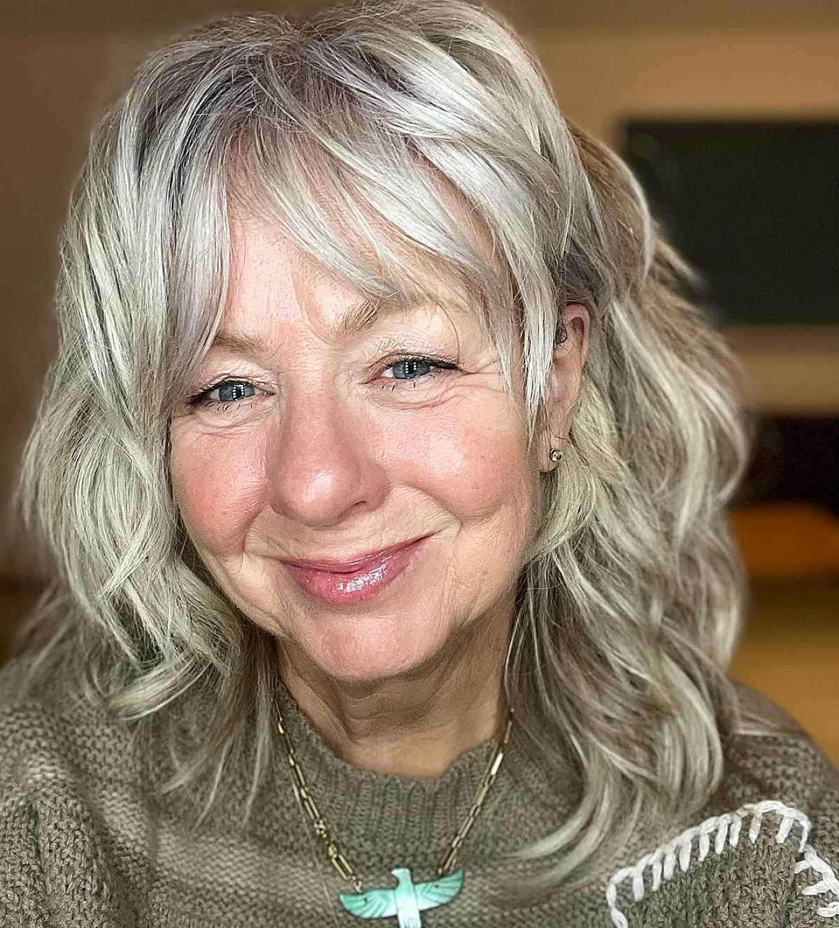 mullet shag with a soft fringe for 60 year olds with wavy hair