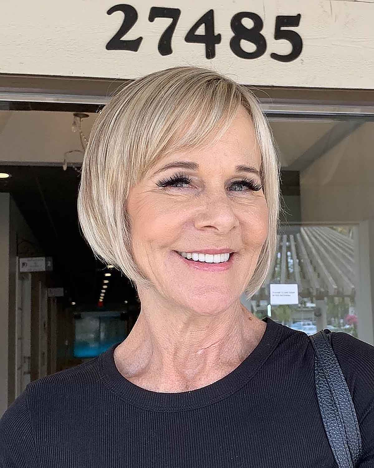 razor cut textured bob with fringe for a sixty year old who has fine hair