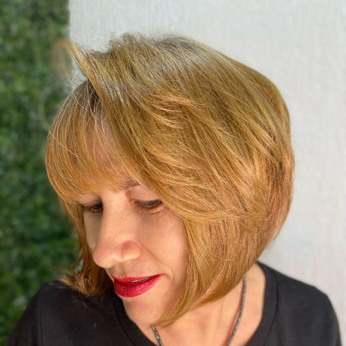 rounded bob with feathered layers for women over 60
