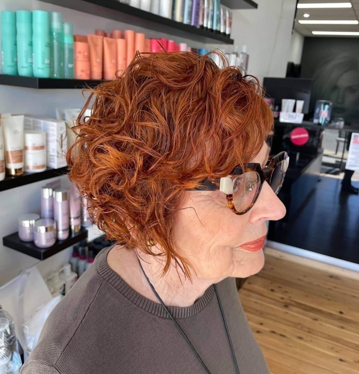 short asymmetrical bob for women over 60 with curly hair