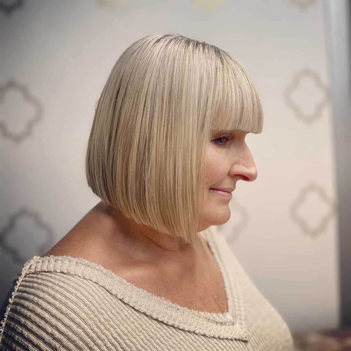 short bob with bangs for women in their 60s 1