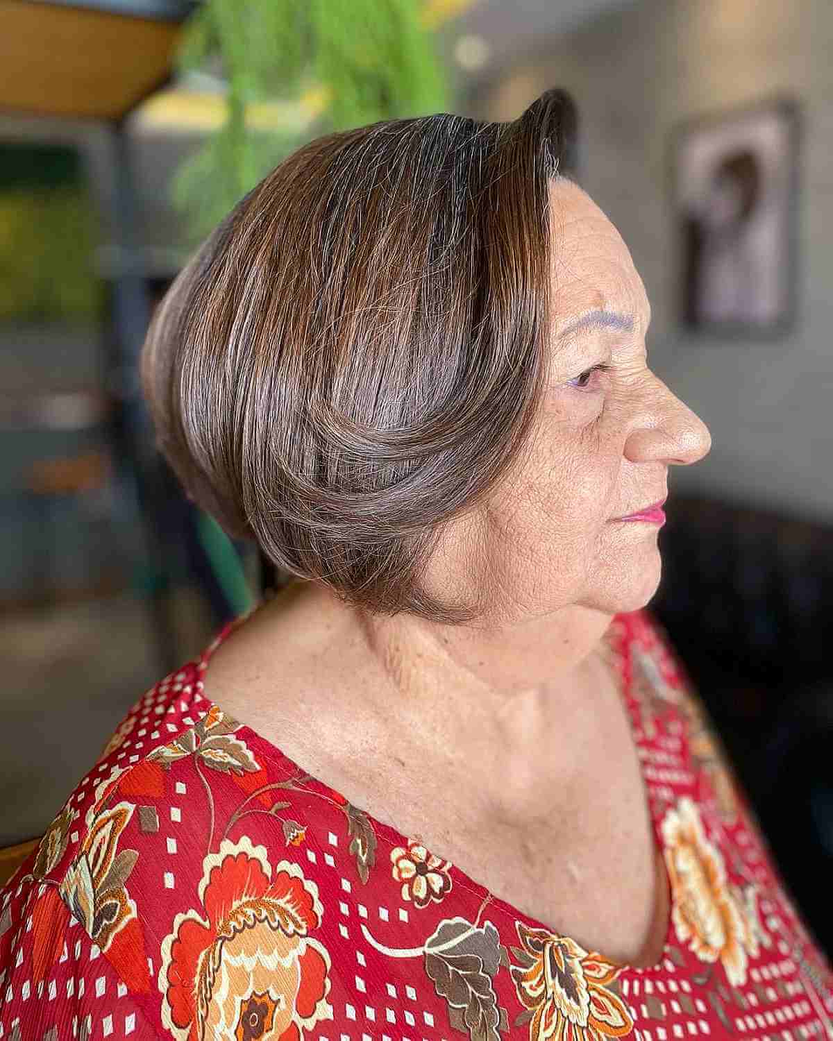 short sleek bob with swoopy front layers for women 60 and over