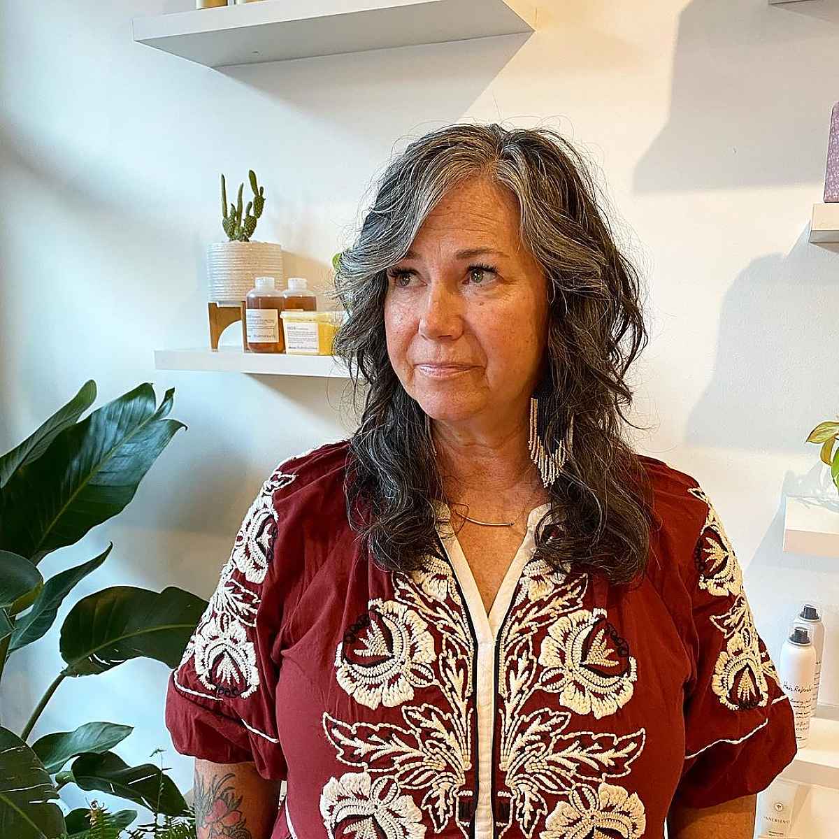 side parted shag haircut for 60 year olds with natural waves