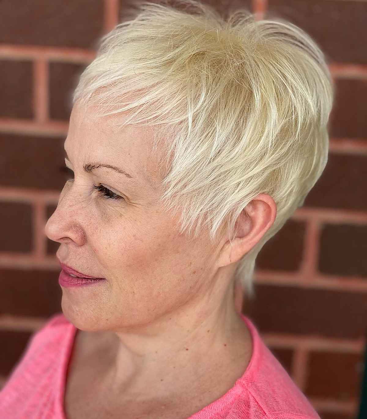 stylish pixie bob with wispy bangs for 60 year olds with thin hair