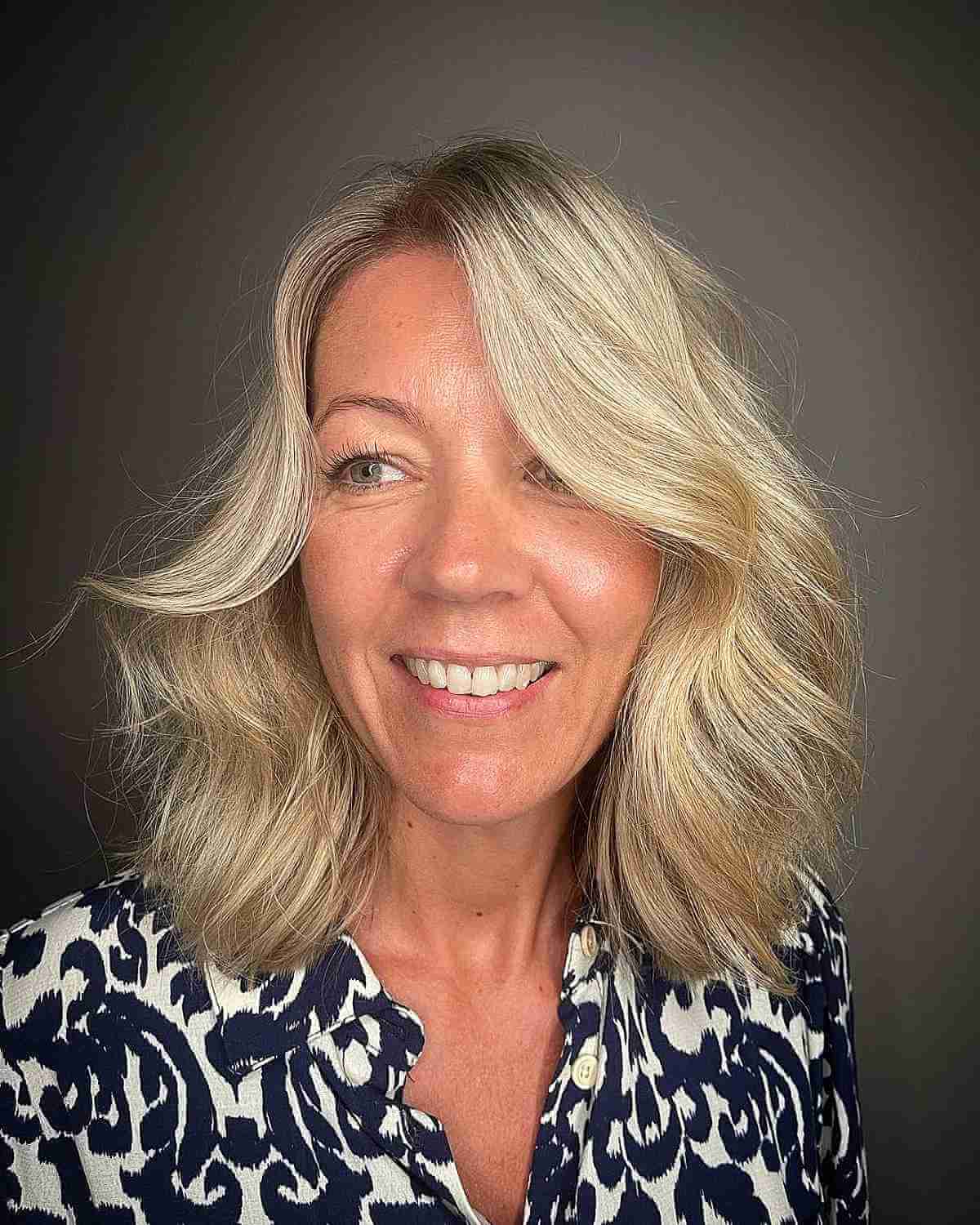 voluminous wavy shoulder length hair for a lady over forty