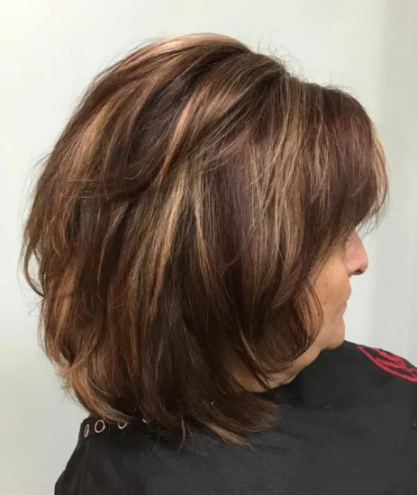 Highlighted Brown Hairstyle with Bangs