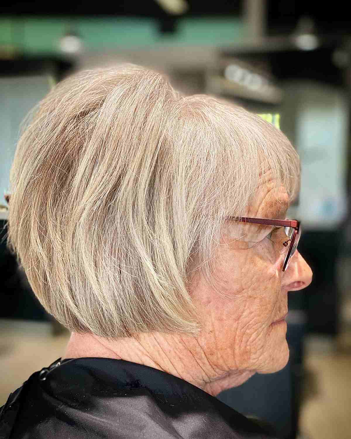 blonde bob with bangs and teased crown