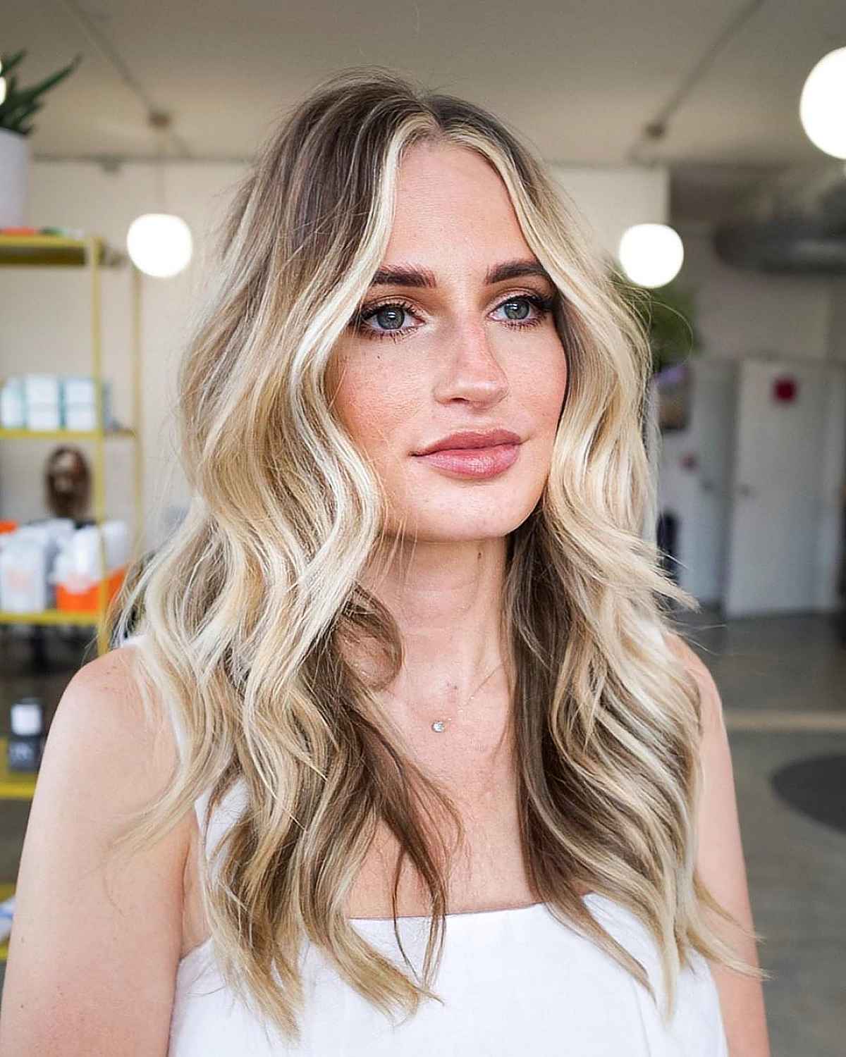 bronde long blunt shag with wispy ends and balayage