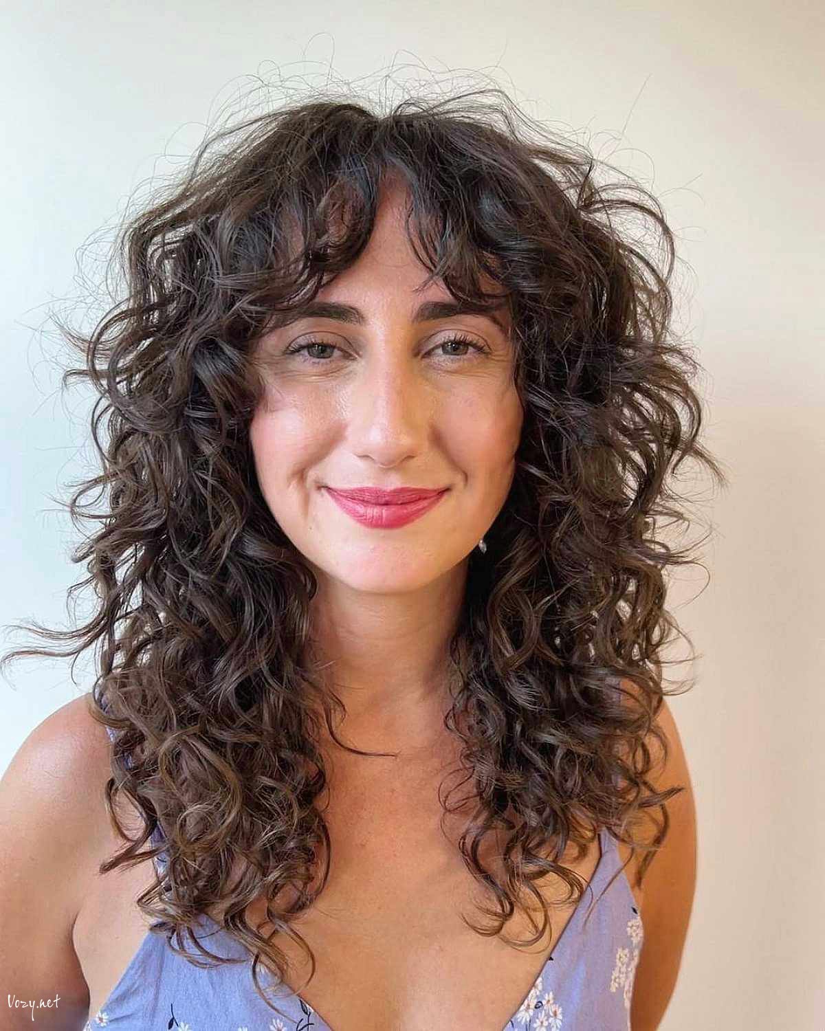brunette shag with frizzy curls